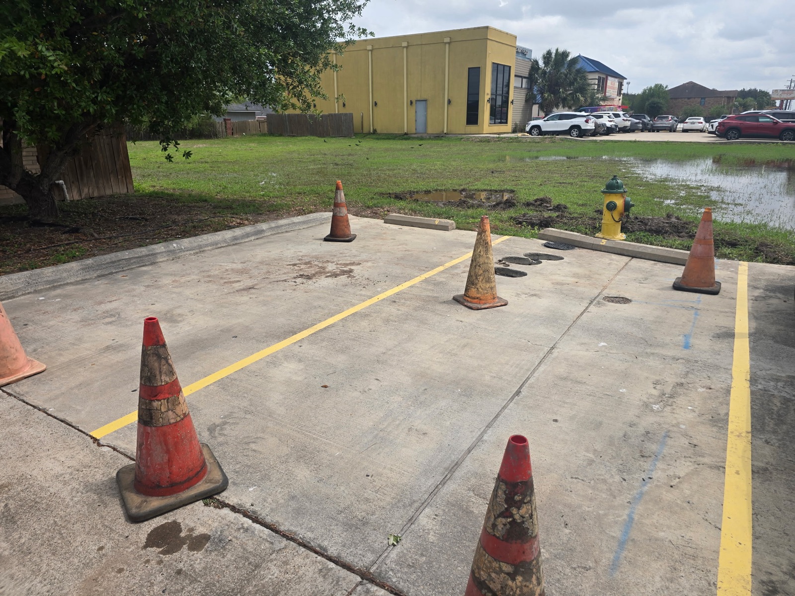 Finished concrete parking lot with yellow striping