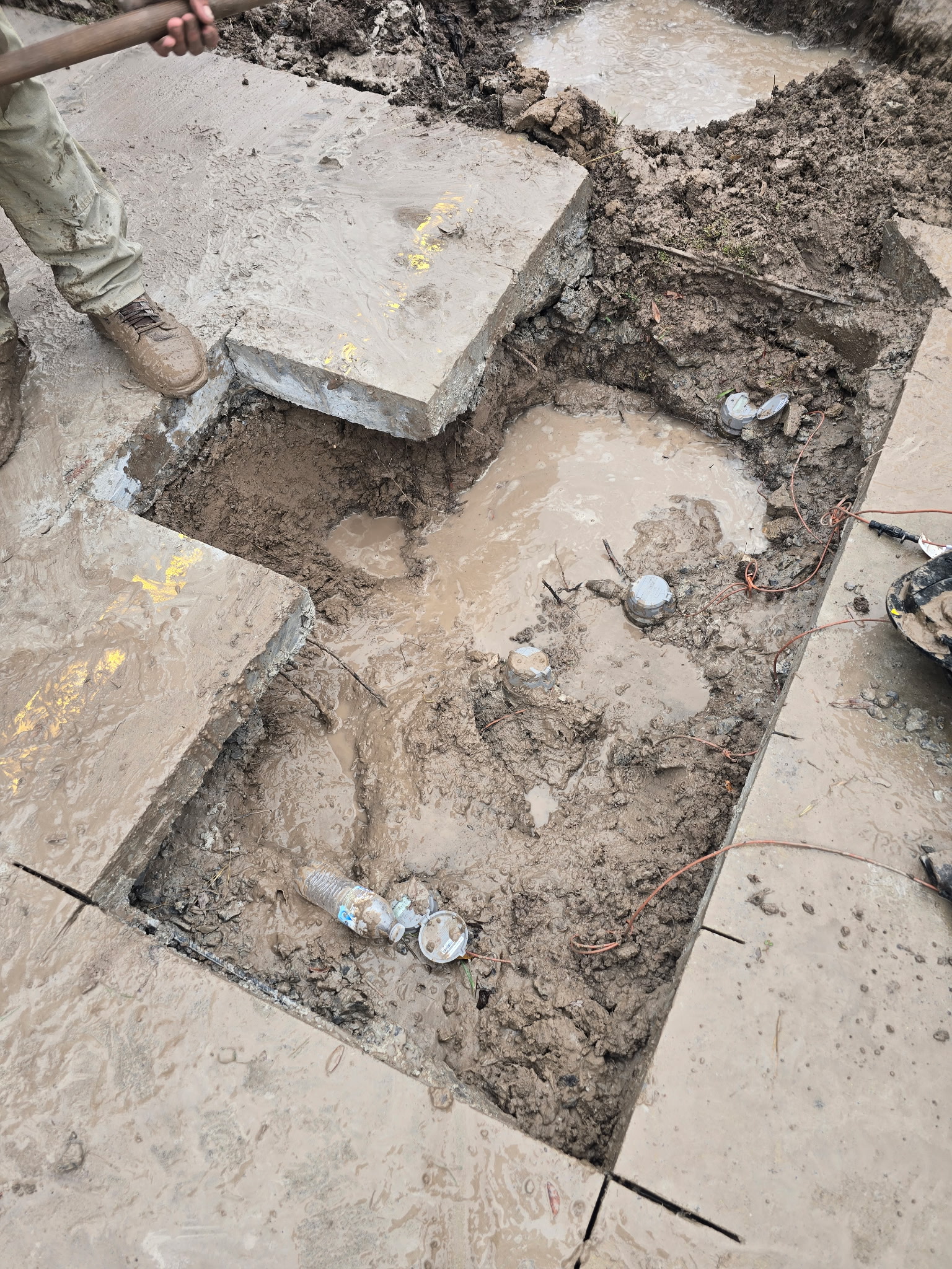 Concrete demolition and slab prep with exposed sub-base, ahead of new driveway pour